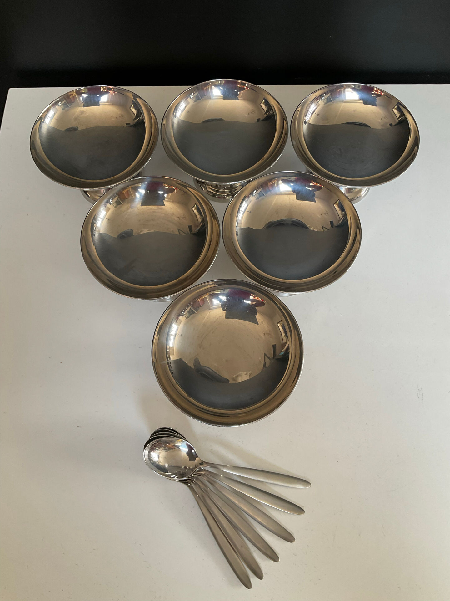 Set of 6 vintage stainless steel ice cream bowls with spoons.