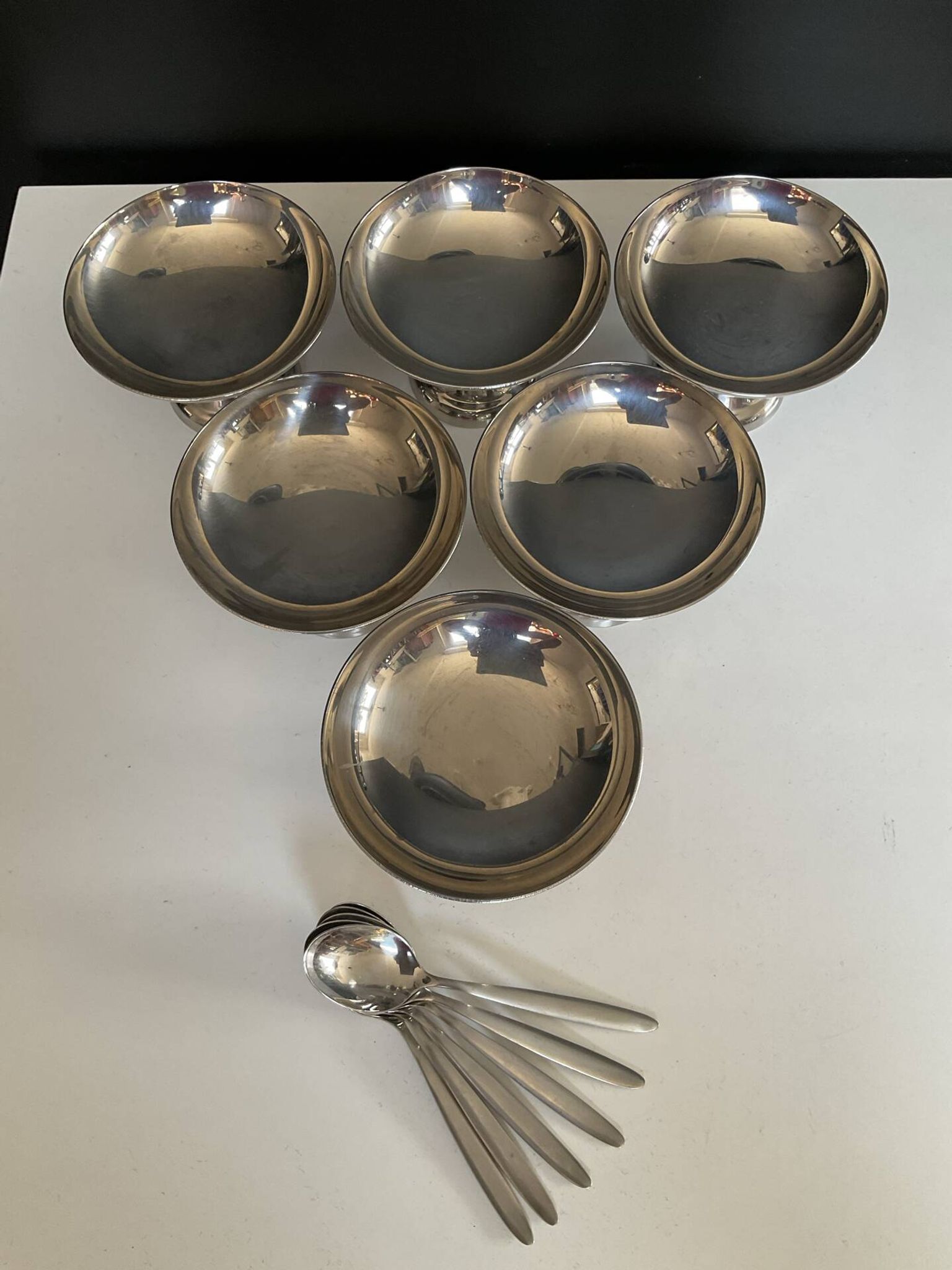 Set of 6 vintage stainless steel ice cream bowls with spoons.