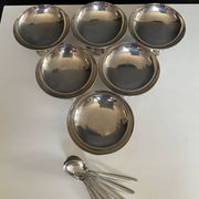 Set of 6 vintage stainless steel ice cream bowls with spoons.