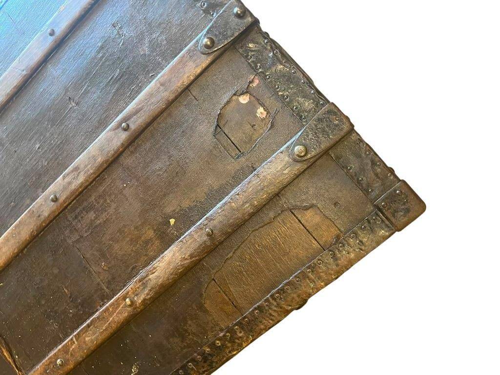 Vintage wooden coffee table with iron fittings.