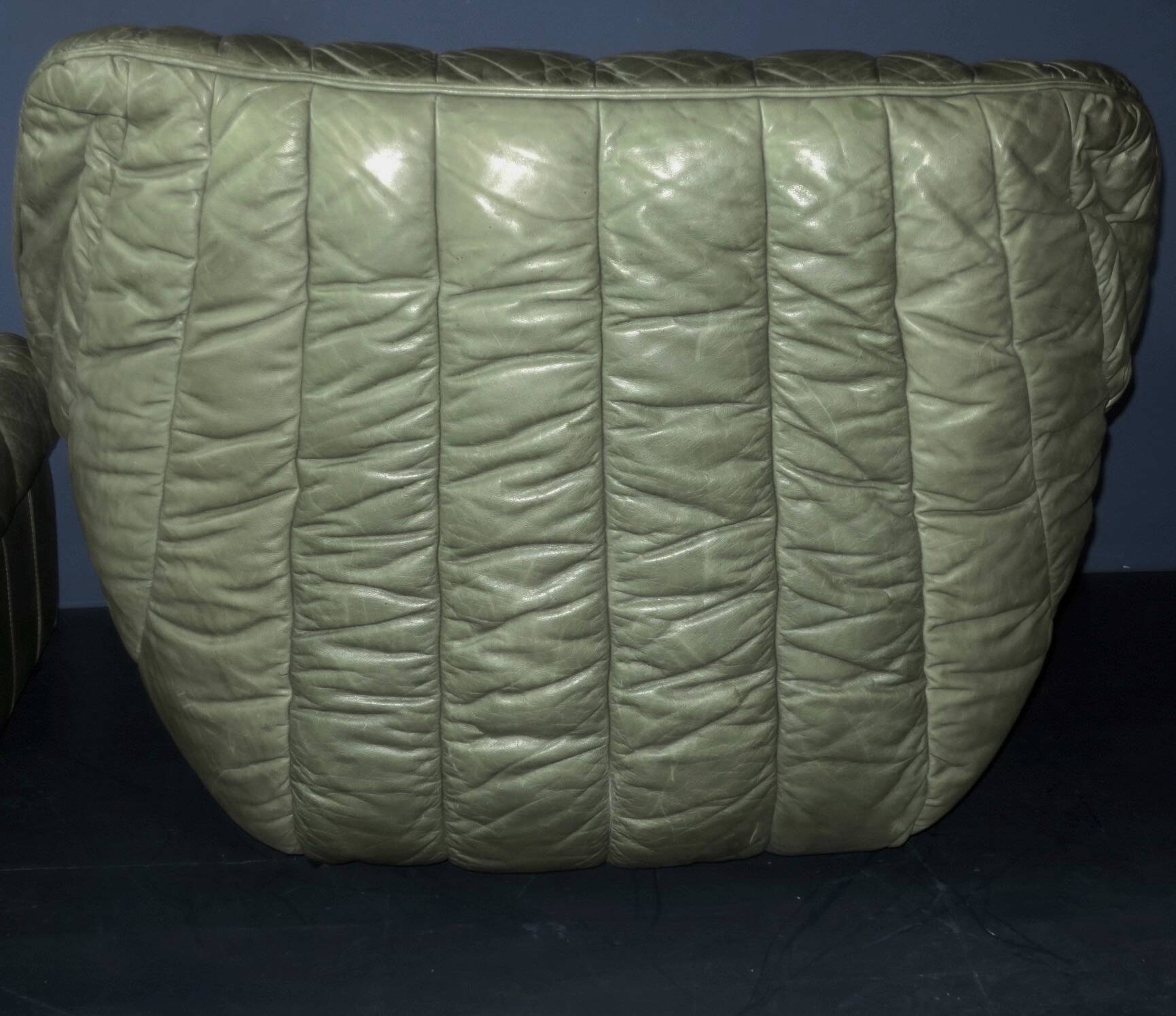 Laauser lounge chair and ottoman in olive green patchwork leather, 1970s