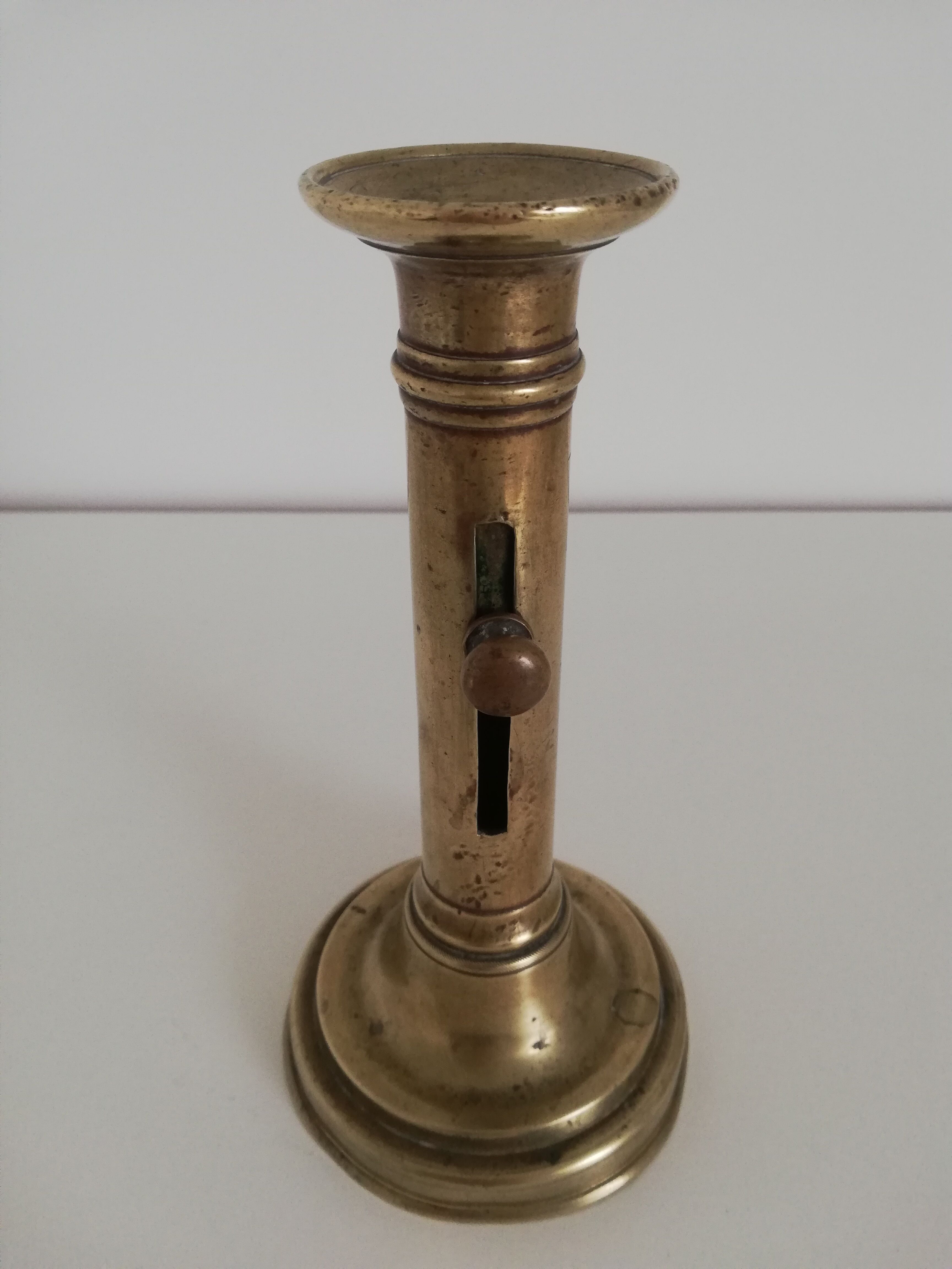 Vintage push candle holder