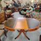 Round Regency dining table in mahogany and green leather with extensions - 20th century