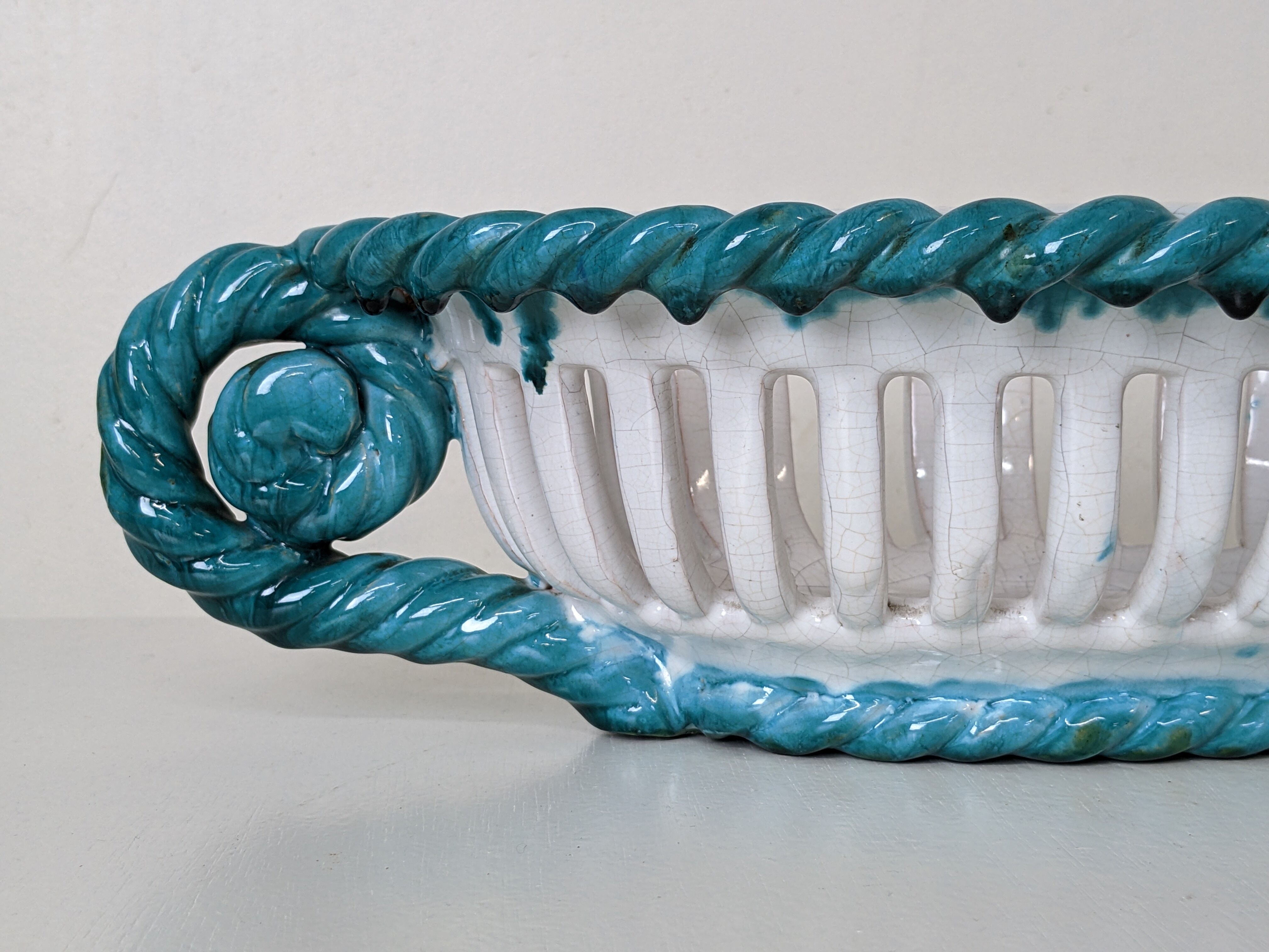 Set of 2 twisted earthenware fruit baskets by Sainte Radegonde, 50s