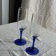 Set of 6 blue-footed champagne flutes; 3 pairs of designs.