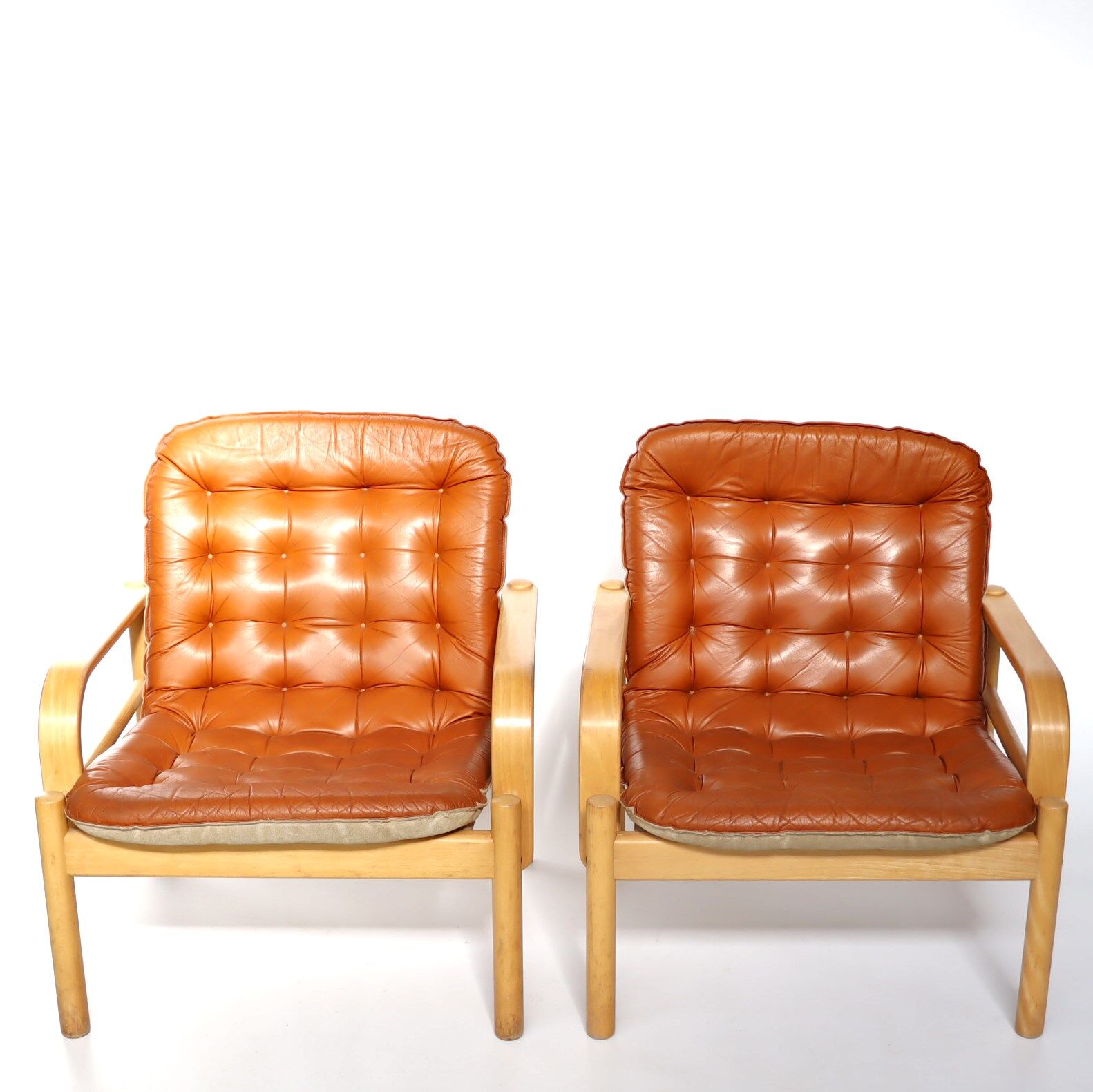 Upholstered leather armchairs 70s
