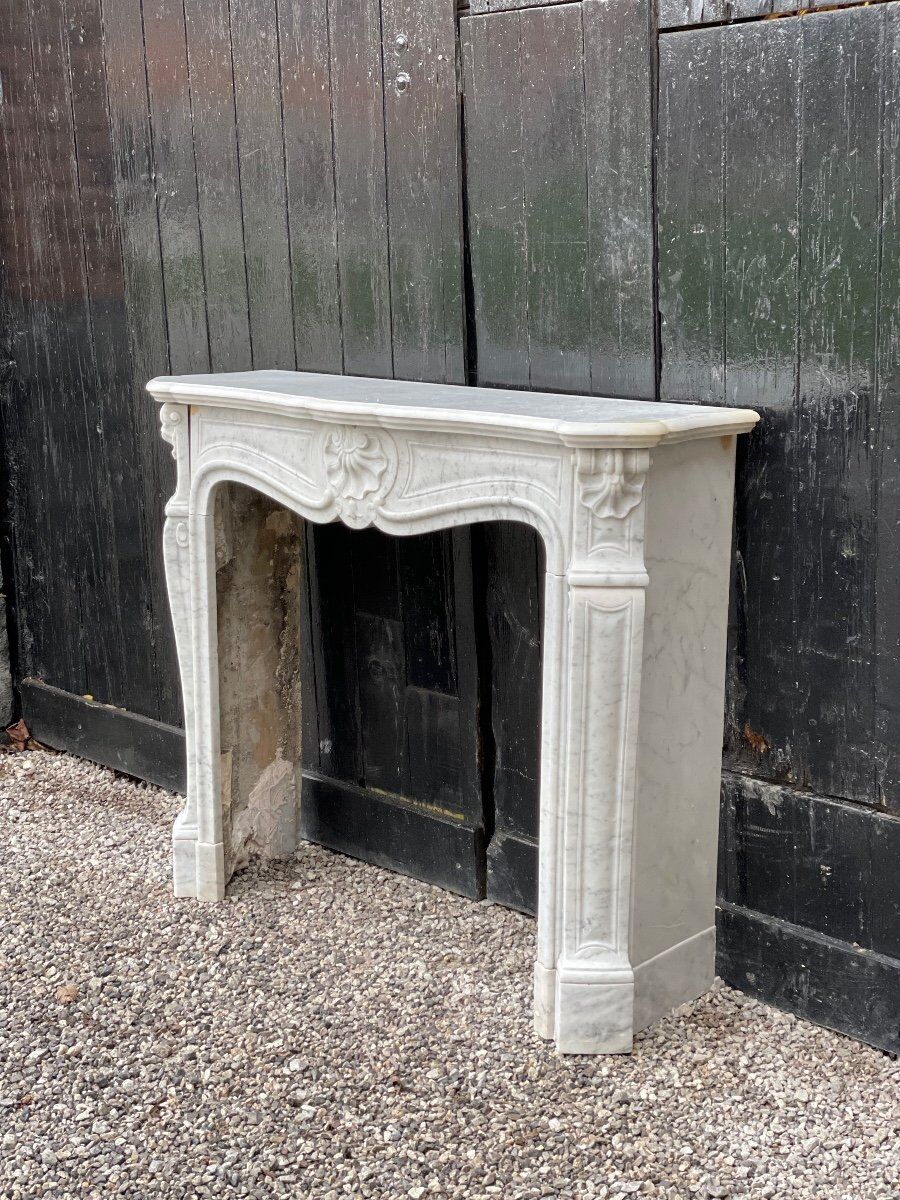 Louis XV style fireplace in Carrara marble
