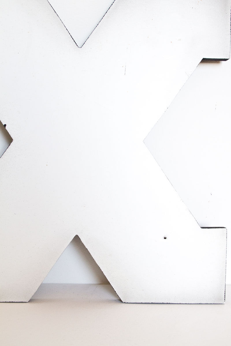 Enamelled letter X