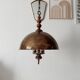 Rustic old wooden and brass suspension.