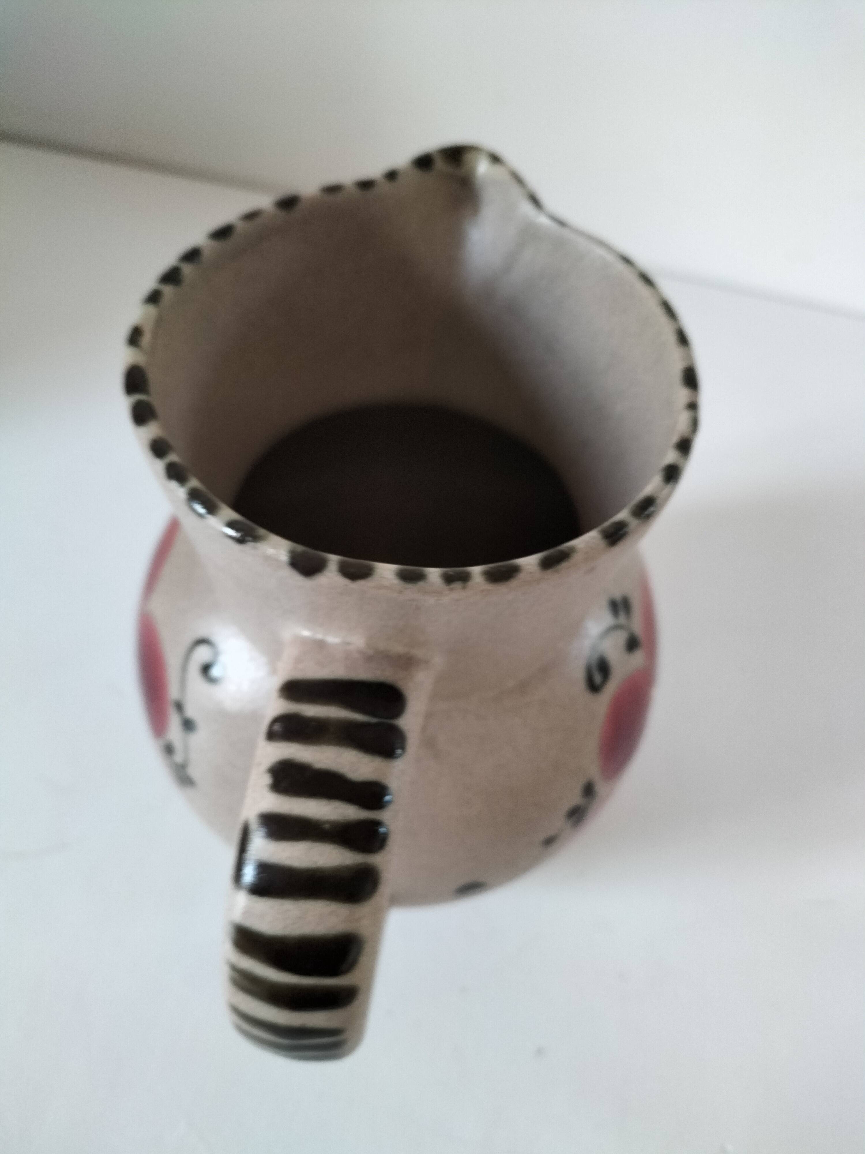 Vintage stoneware pitcher with hand-painted floral decoration, 1960s–70s