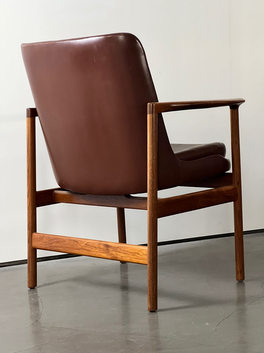 Leather and wood armchair by Ib Kofod Larsen