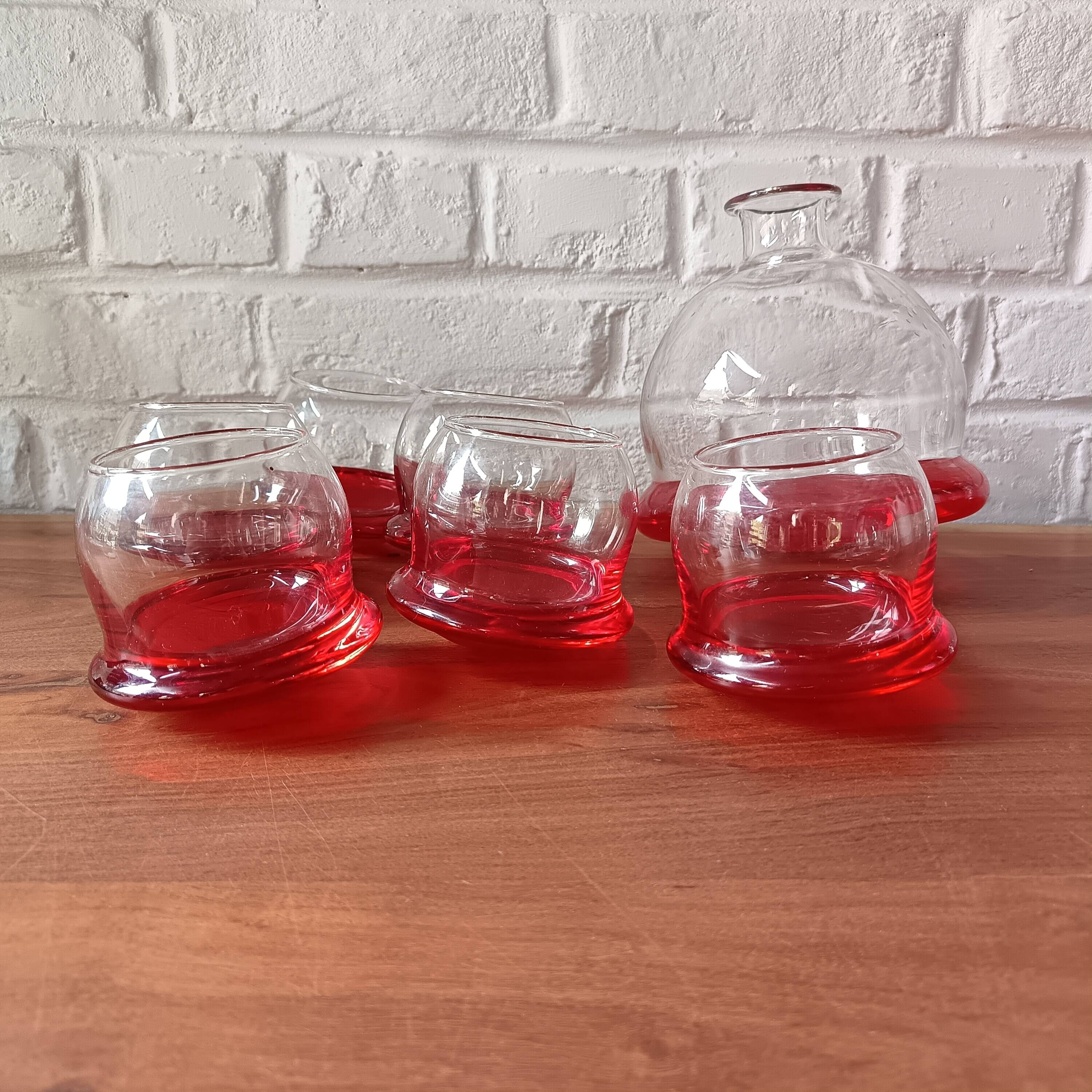 Vintage red designer glasses and carafe set, tumbler glass base
