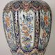 Ancient vase fully decorated with ceramic plants, 20th century.