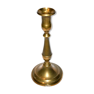 Old candlestick candleholder in gilded brass
