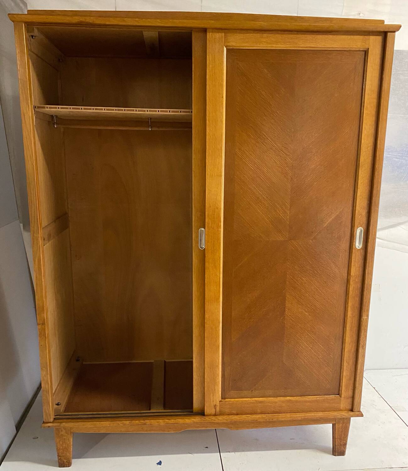 Vintage wardrobe with compass feet, sliding doors