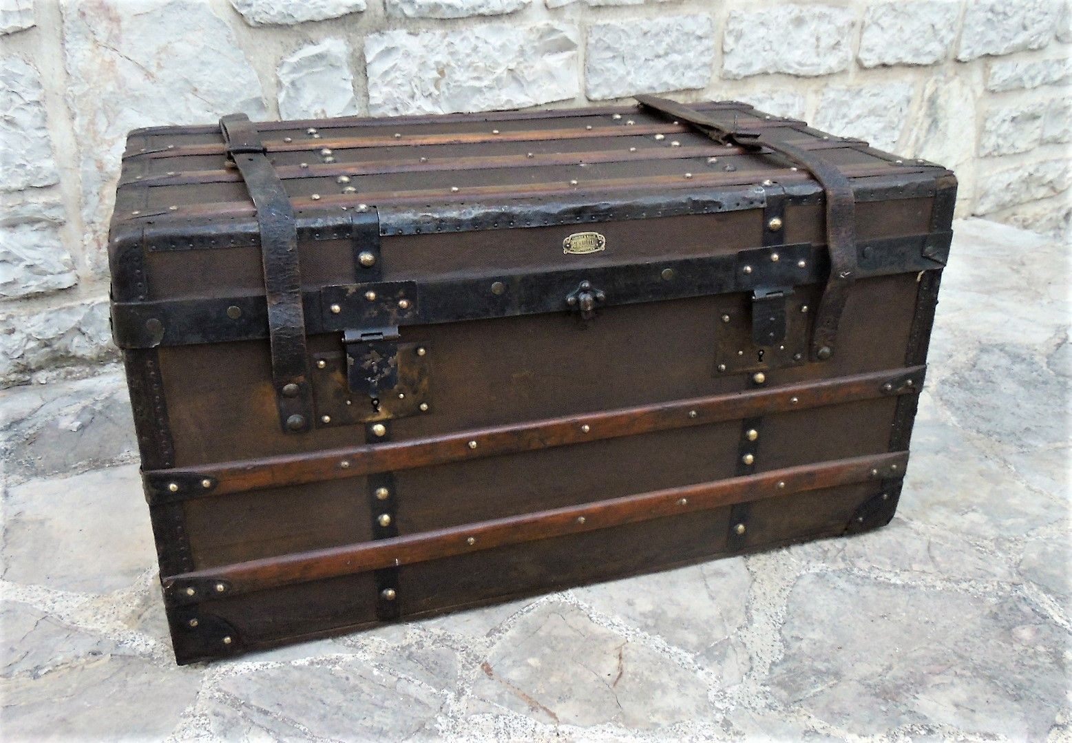 Old wooden and leather trunk, old brass nail trunk and leather strap