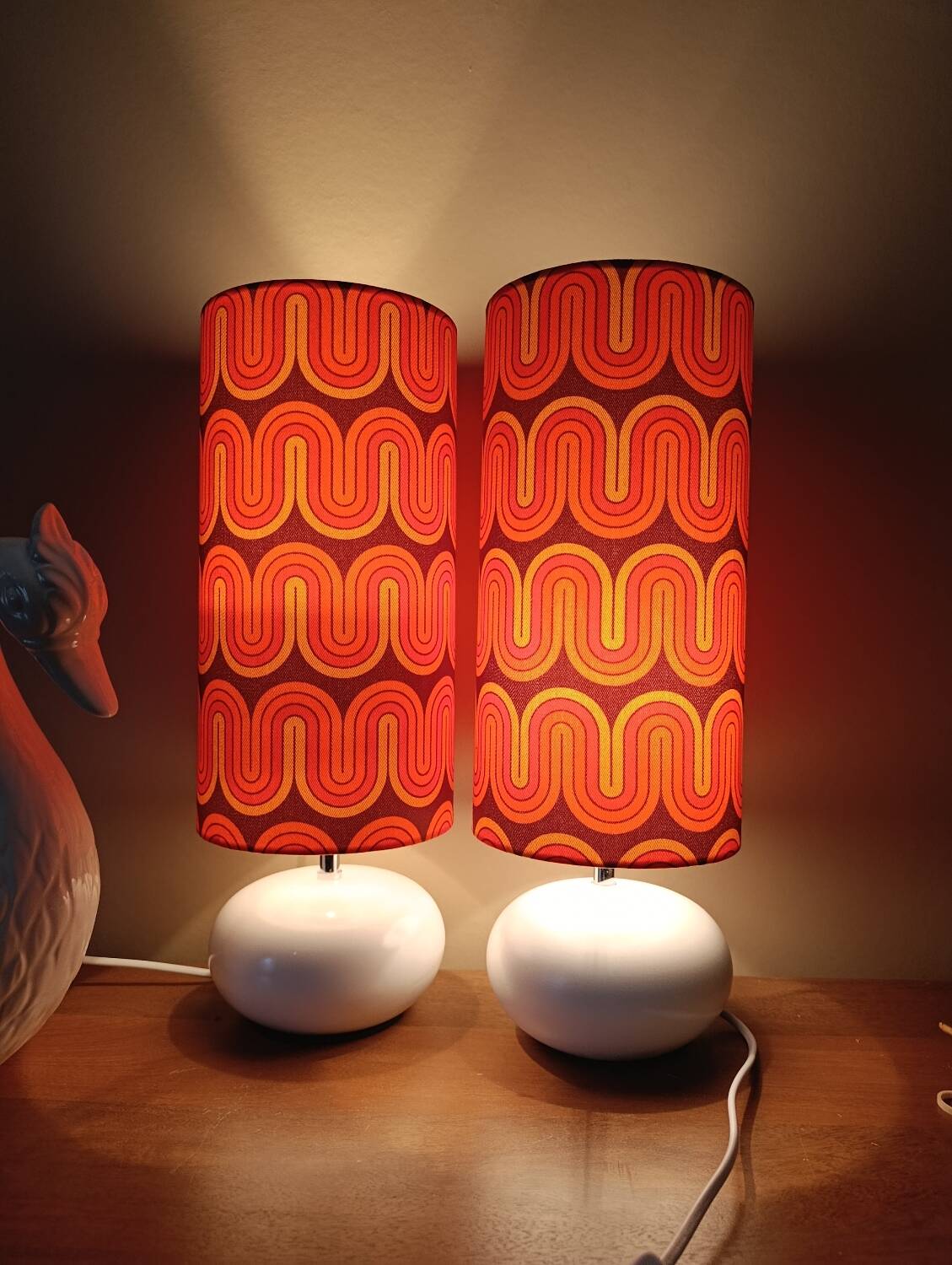 Two lamps with a seventies psychedelic wave print.