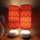 Two lamps with a seventies psychedelic wave print.