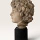 Plaster bust on a wooden base