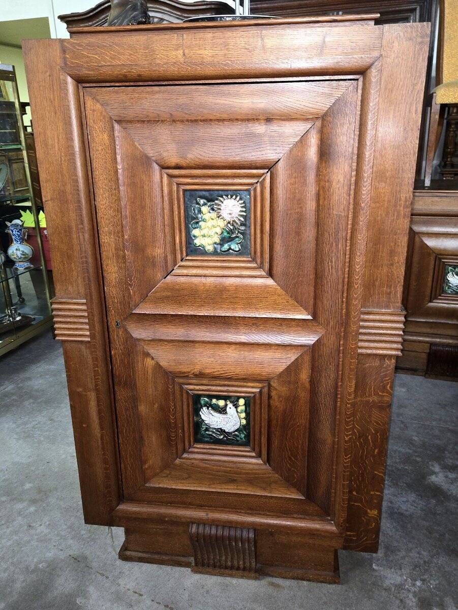 According to Maxime Old: decorative furniture in oak and ceramic from the Art Deco period (B)