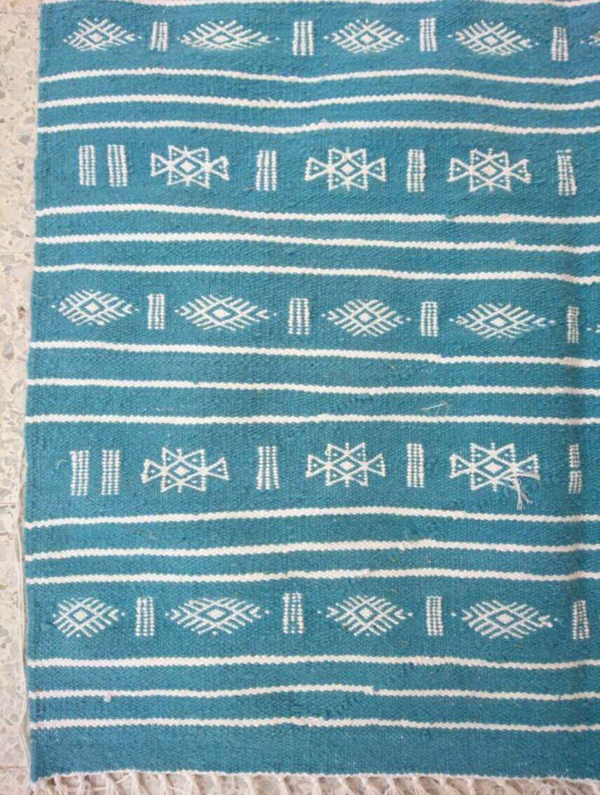 Hand-woven blue and white kilim rug in natural wool