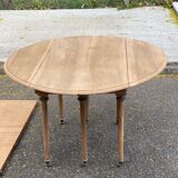 Renovated Louis Philippe round extendable dining table with leaves from the 18th century.