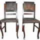 Pair of brown embossed leather chairs with brass studs and wooden frame, 1900s