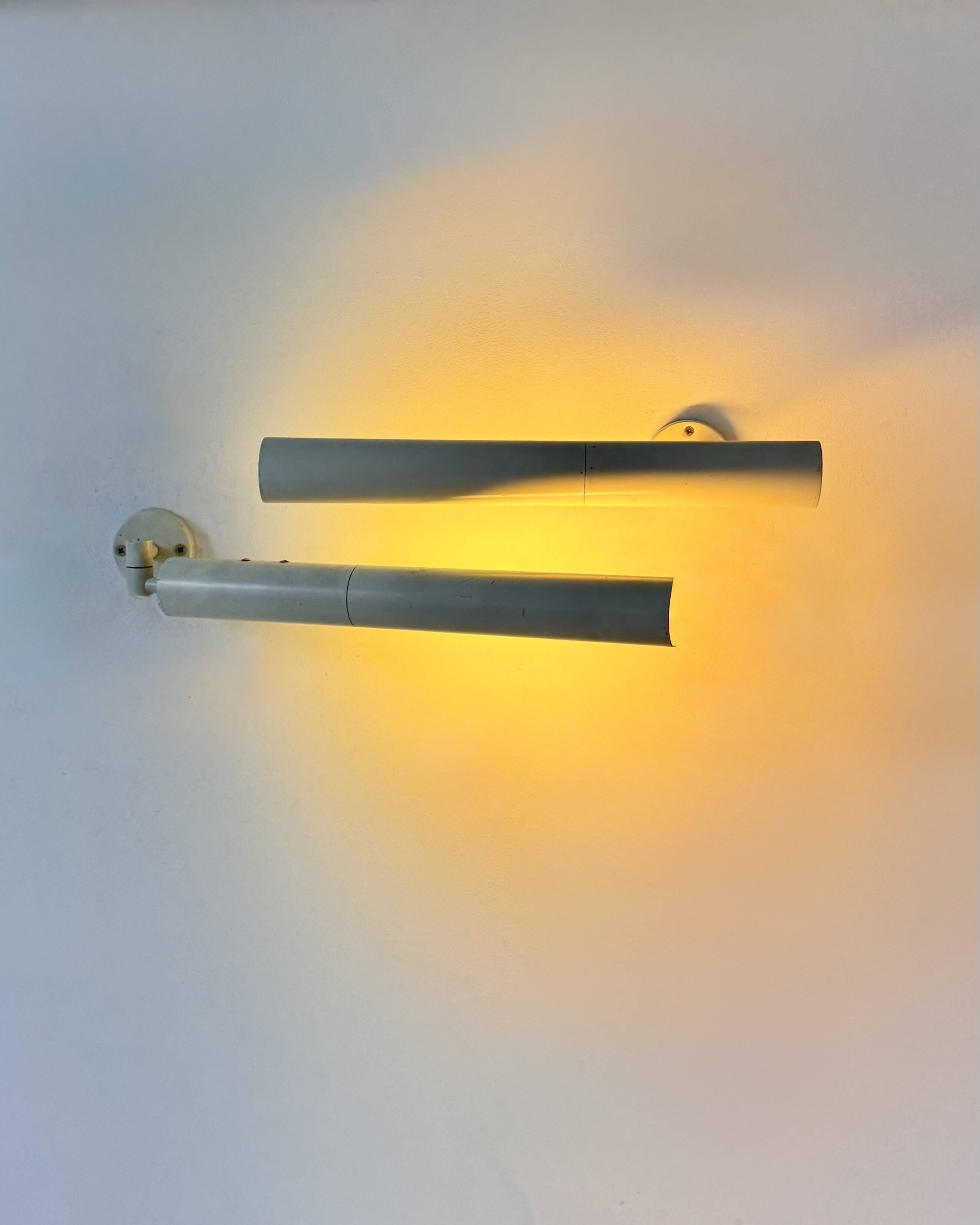 Pair of vintage matte white metal wall lights, France 1970.