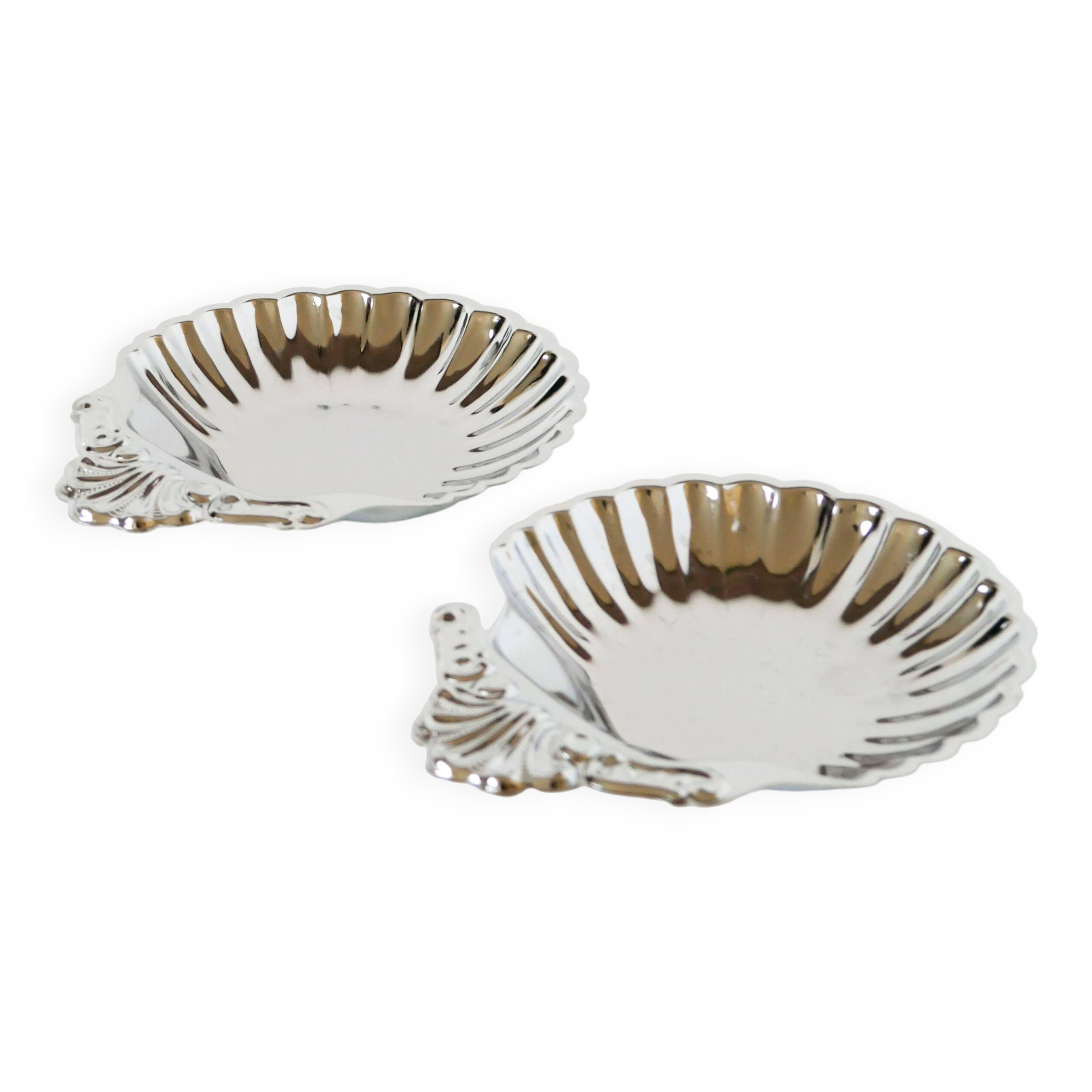 Pair of worked stainless steel shell trinket trays, 1970