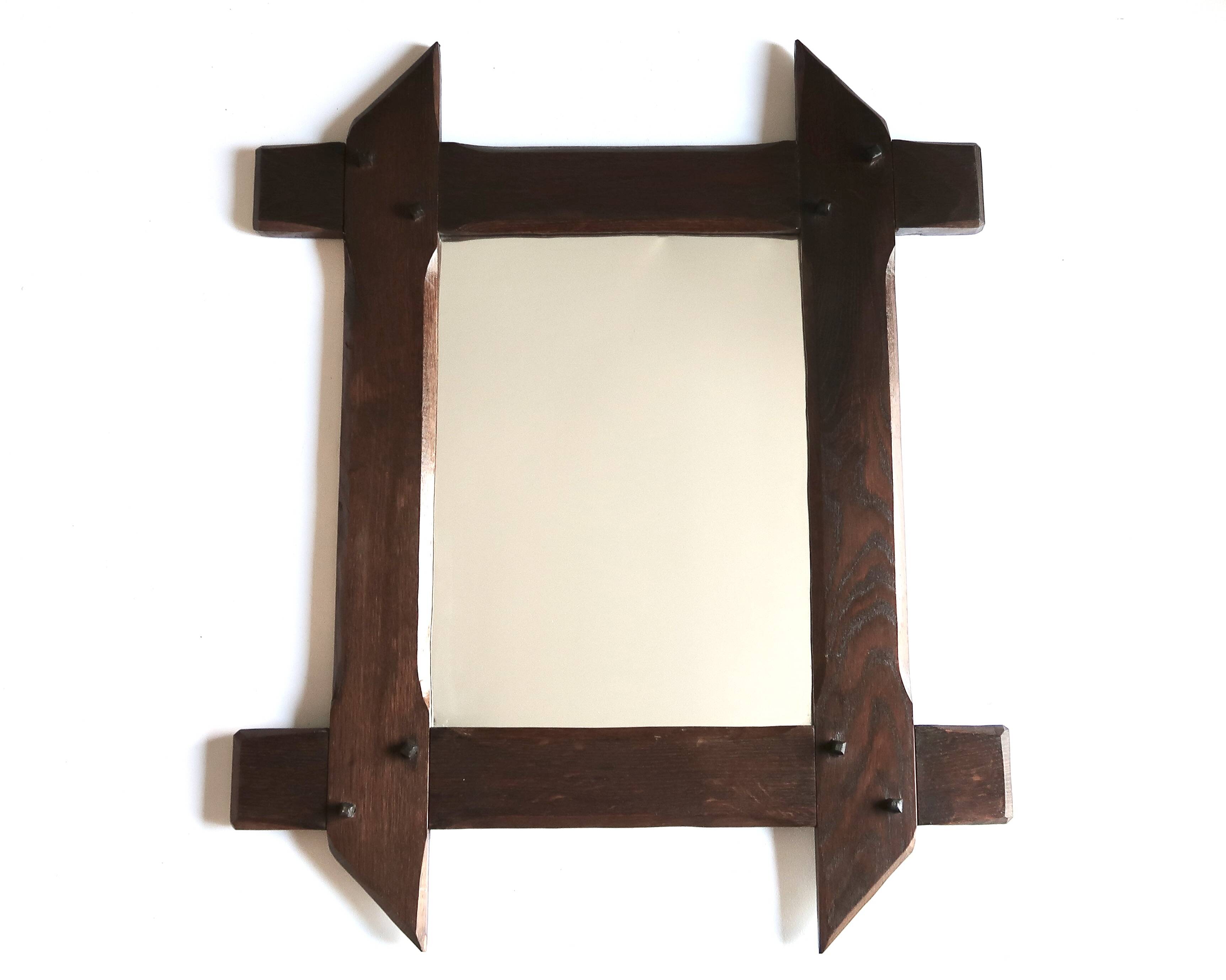 Rectangular mirror with bevelled wooden frame, 1970s.
