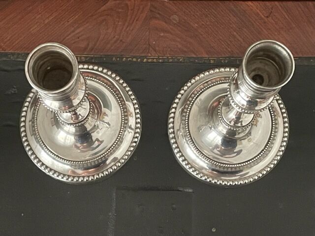 Pair of Christofle silver metal candle holders.