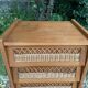 Vintage rattan chest of drawers with splayed legs from the 1950s.