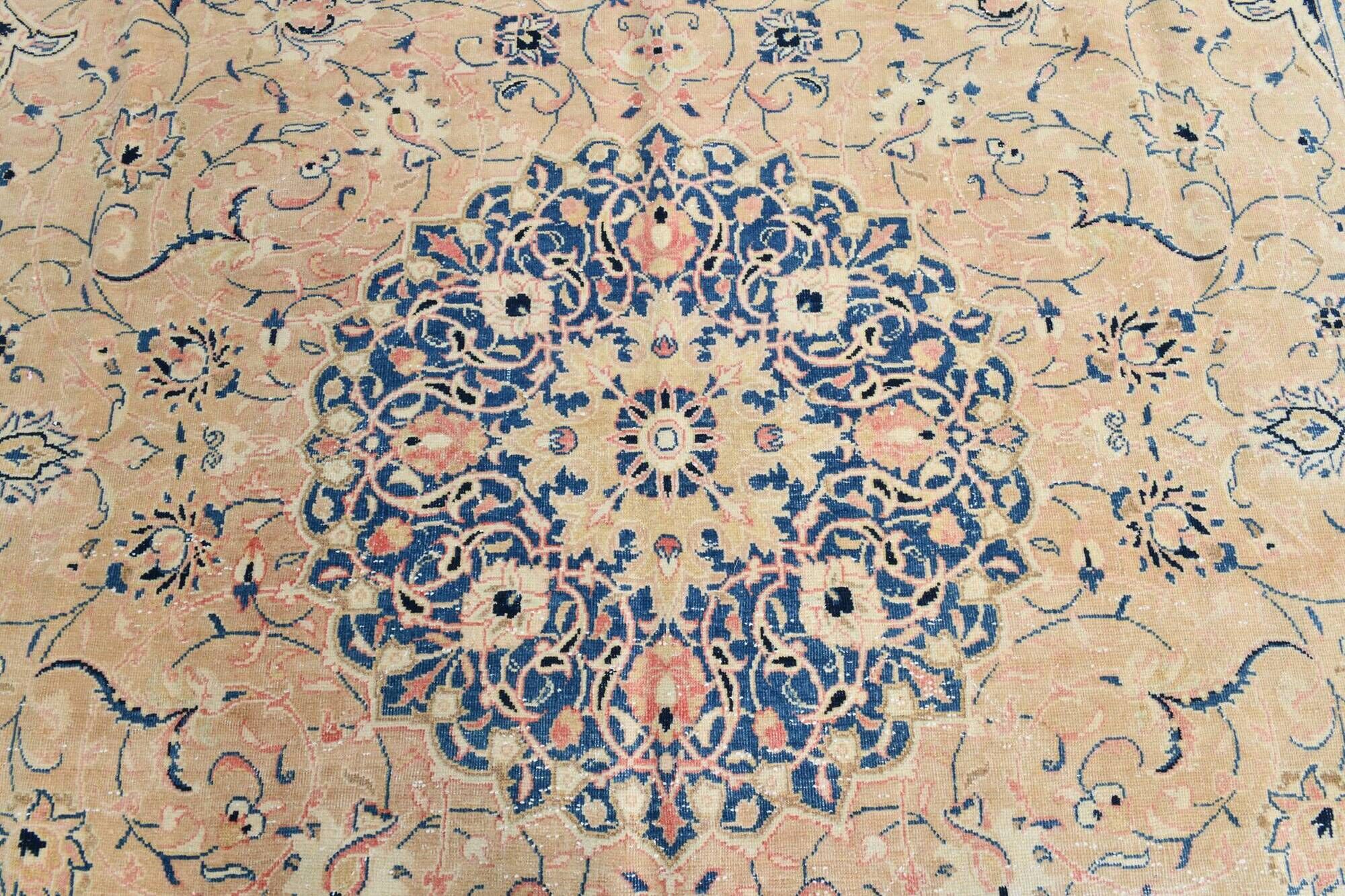 Antique Turkish wool rug in faded floral patterns, 10 x 13 feet.