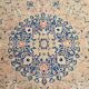 Antique Turkish wool rug in faded floral patterns, 10 x 13 feet.