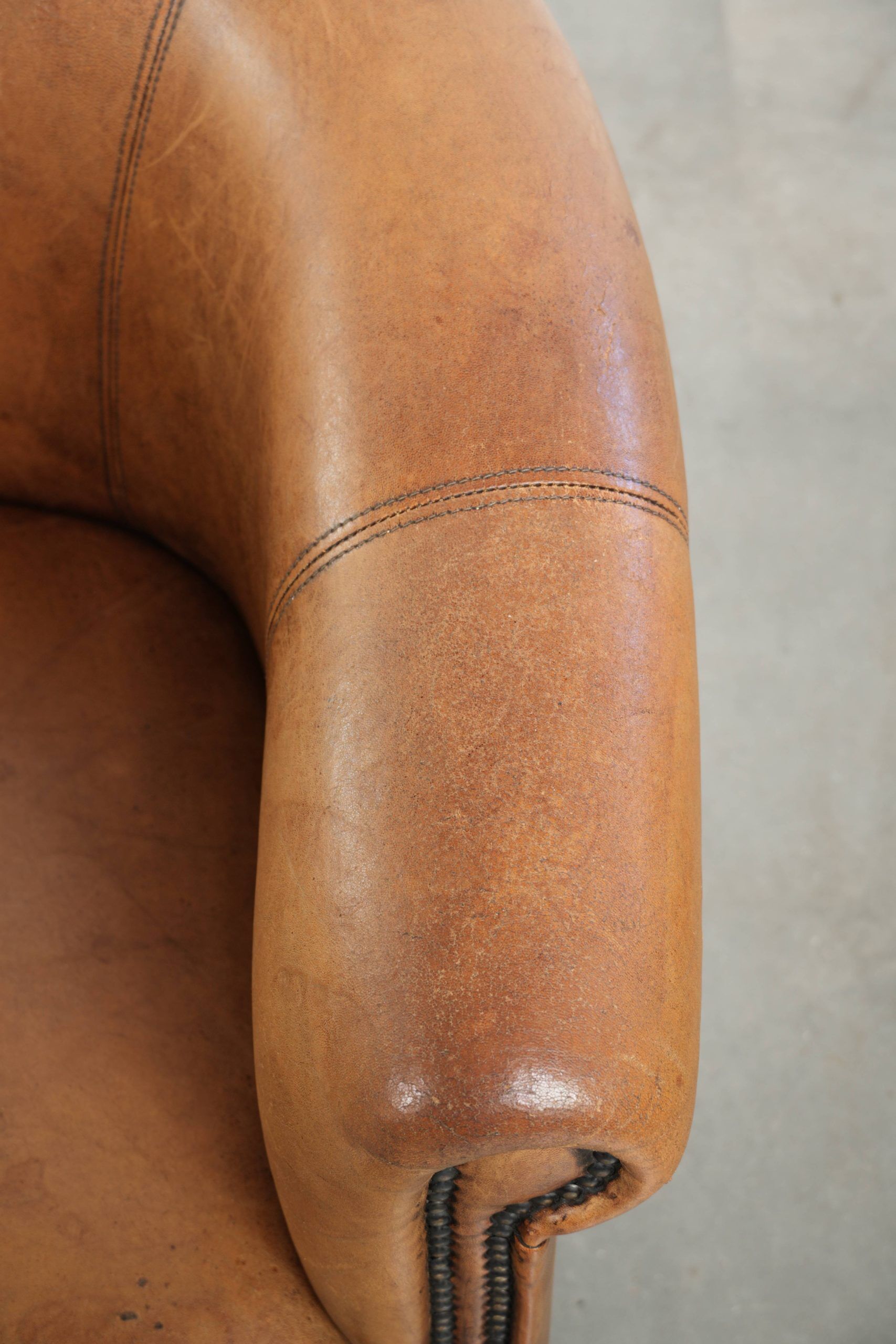 Set of two vintage sheepskin club armchairs with a beautiful light colour