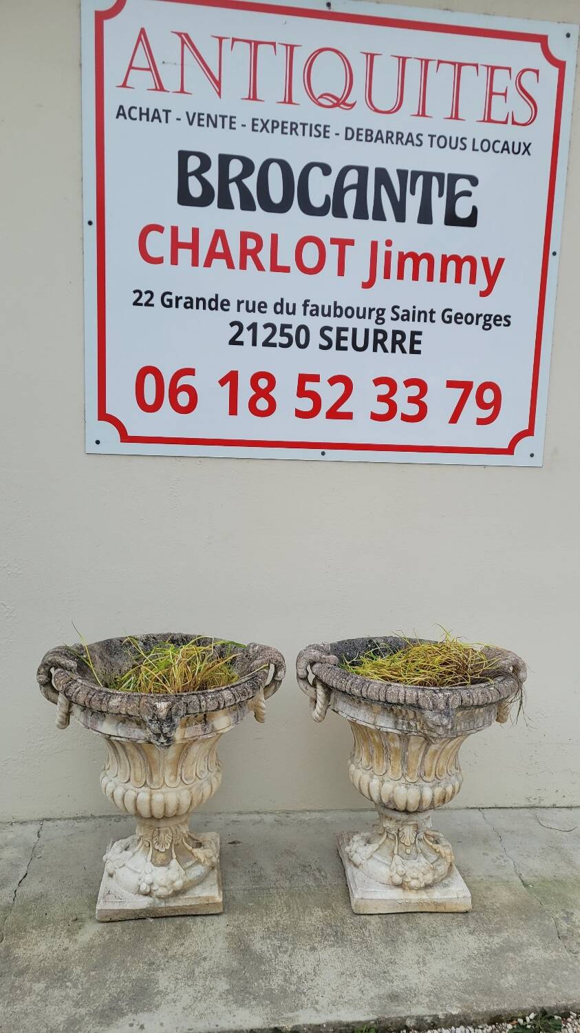 Pair of planter vases decorated with faces in reconstituted stone 1950s