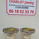 Pair of planter vases decorated with faces in reconstituted stone 1950s