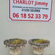 Pair of planter vases decorated with faces in reconstituted stone 1950s