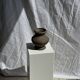 Small brutalist handcrafted terracotta vase with a pedestal, Indonesian, H19 D17.