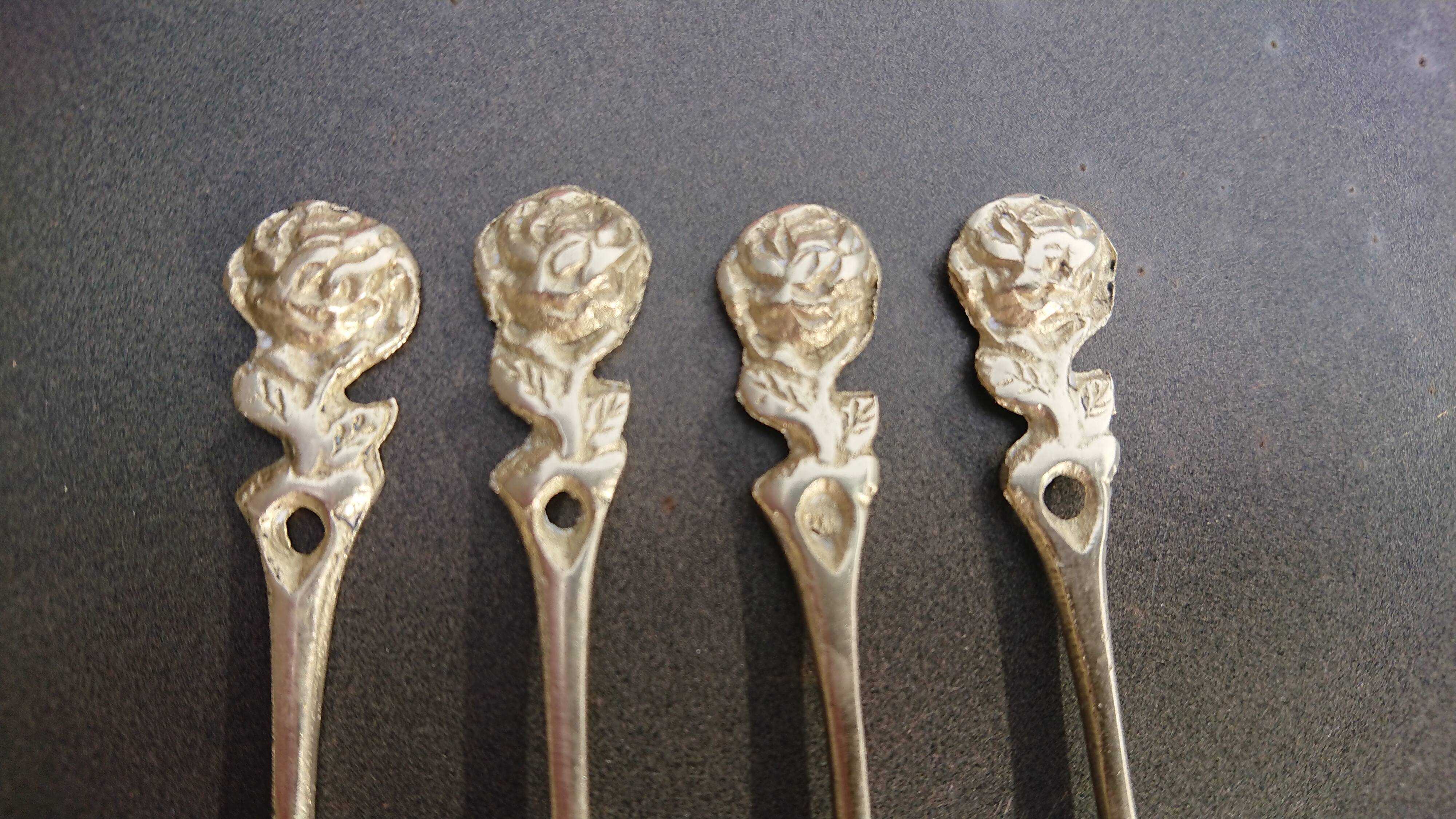 Small golden spoons with punch