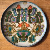 Vintage ceramic plate with peacock bird decoration.