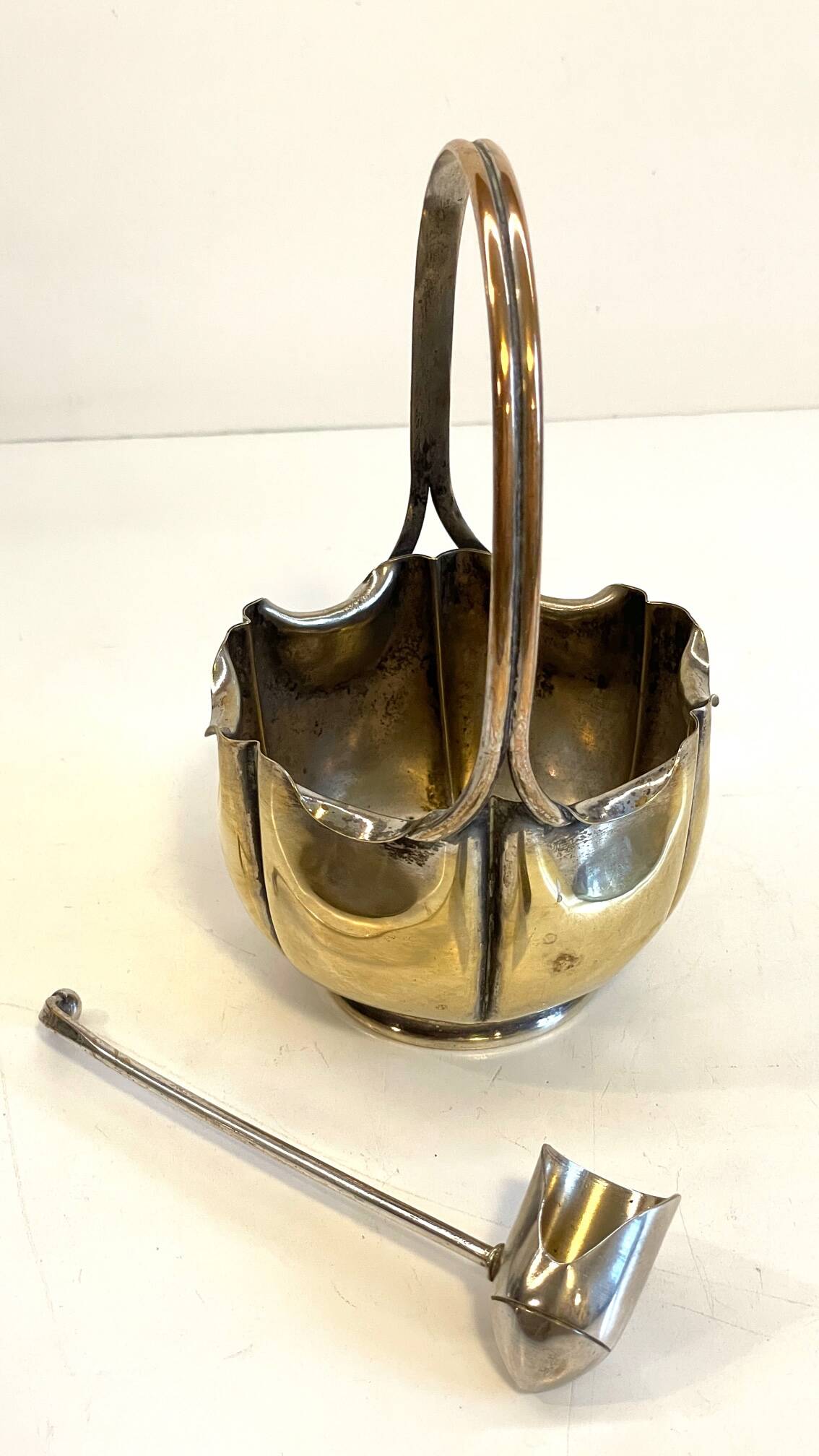 silver metal sugar bowl with gold patina