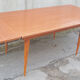Dining table, formica, wooden feet, 50