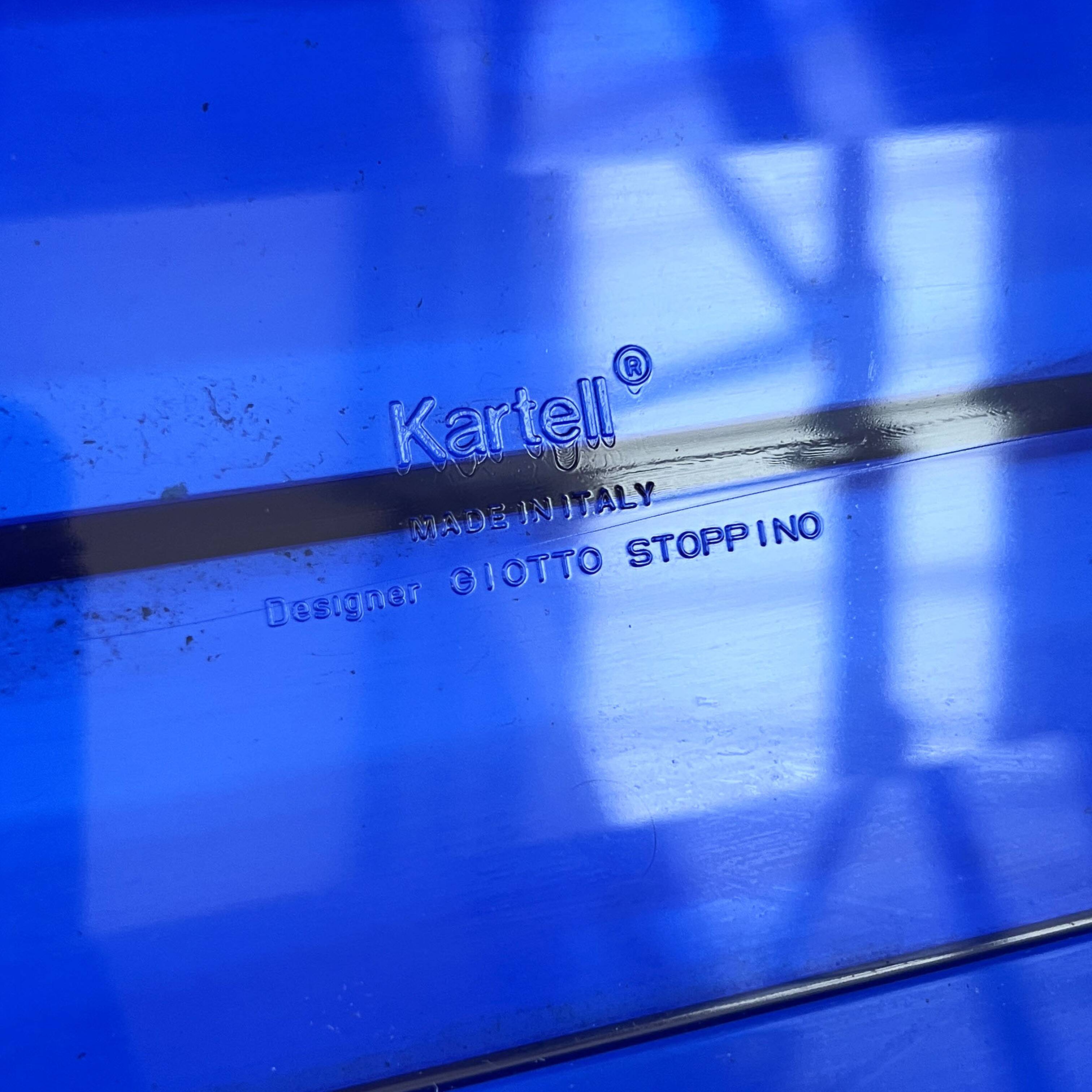 Blue transparent magazine rack by Giotto Stoppino for Kartell, 1970.