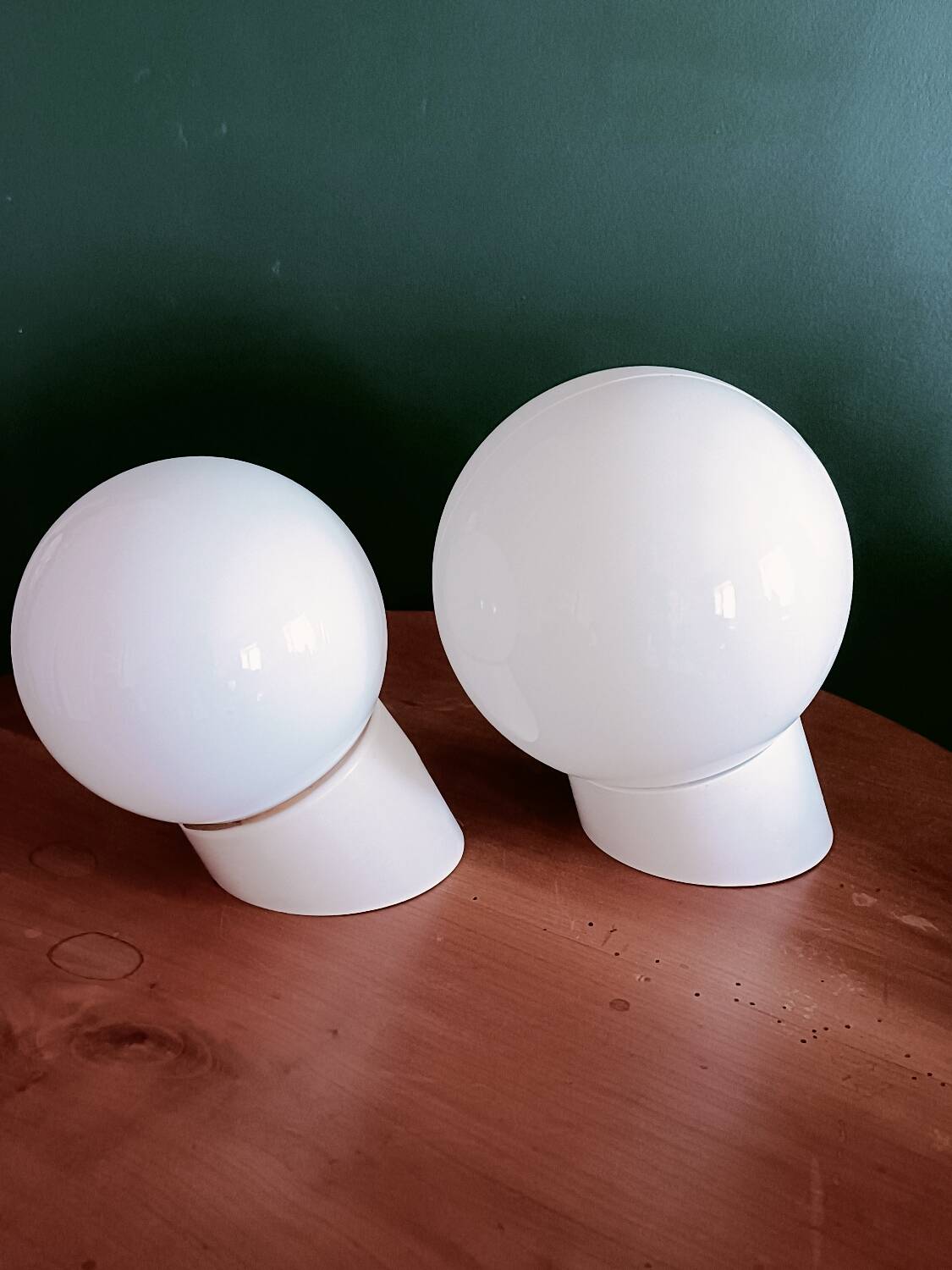 Two opaline glass globe wall lights