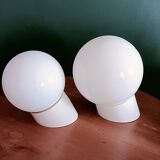 Two opaline glass globe wall lights