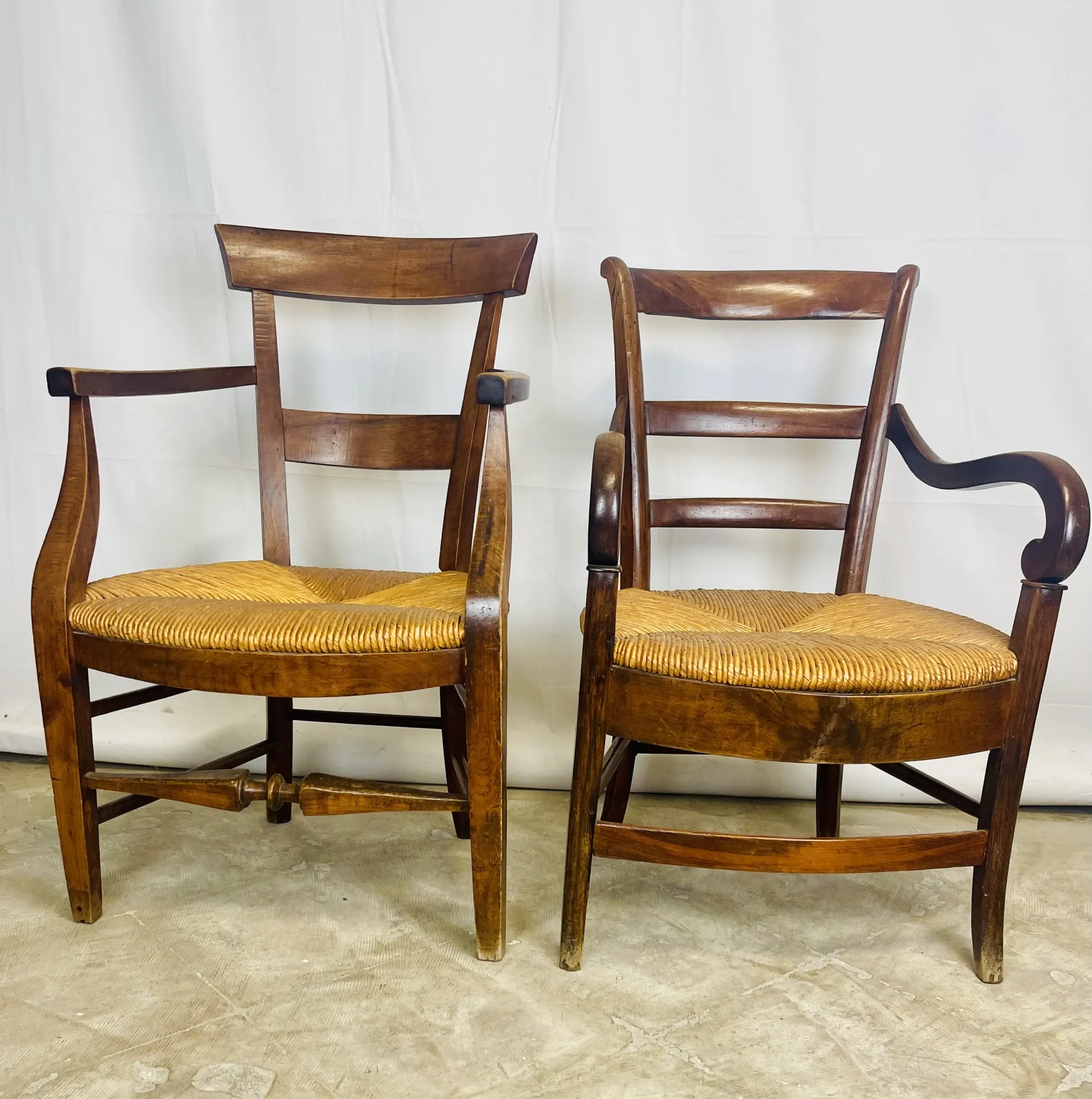 Pair of dissimilar walnut armchairs