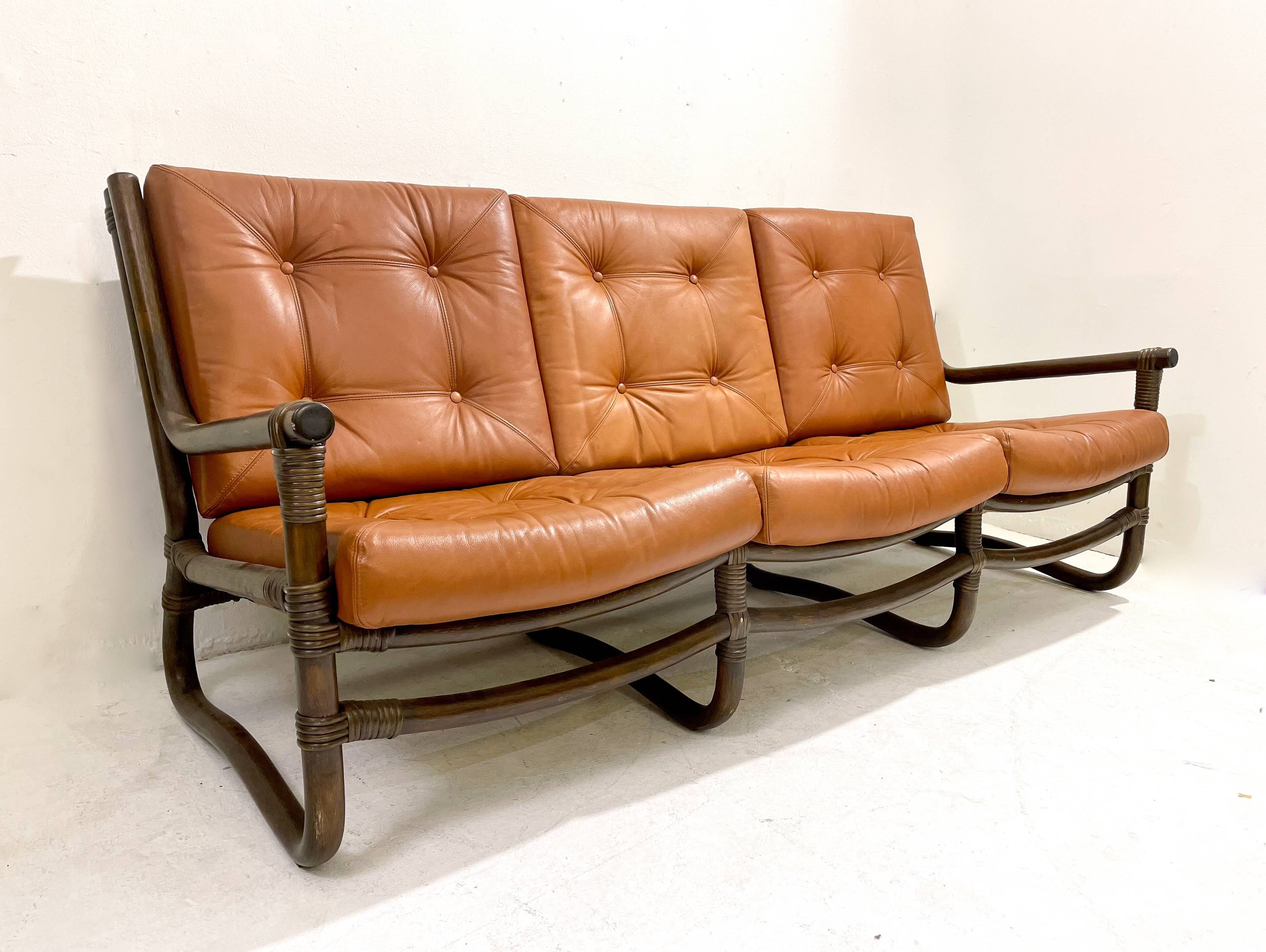 Mid-century modern rattan and cognac leather sofa