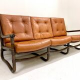 Mid-century modern rattan and cognac leather sofa