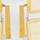A pair of chairs with armrests, 1970s